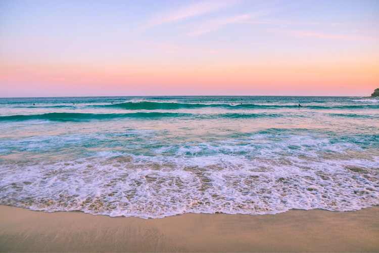 Sunset on a beach. What To Pack For A Caravan Holiday