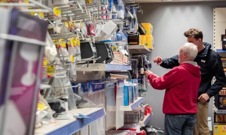 Staff assisting a customer in Webbs caravans' accessory shop, Salisbury.