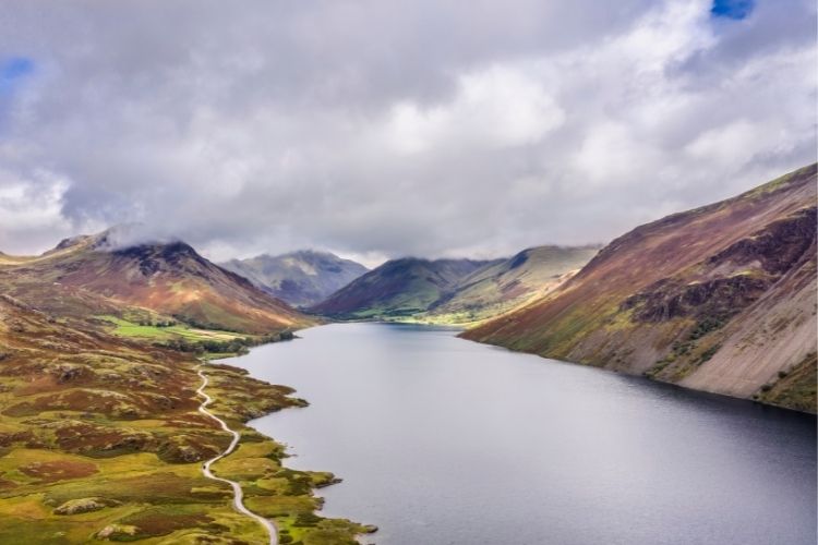 A large lake surrounded by mountains in the Lake District. The Most Romantic UK Destinations To Go In Your Motorhome by Webbs.