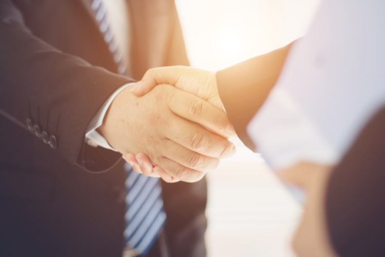 Two people shaking hands and completing a deal. A Guide to Part-exchanging your Motorhome or Caravan by Webbs.