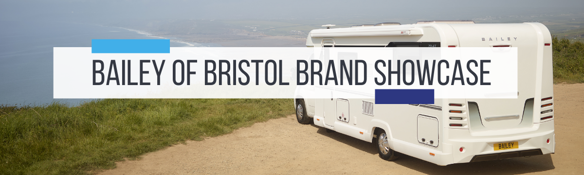 A Bailey motorhome parked in a car park on a cliff by the sea. Bailey of Bristol Brand Showcase by Webbs.
