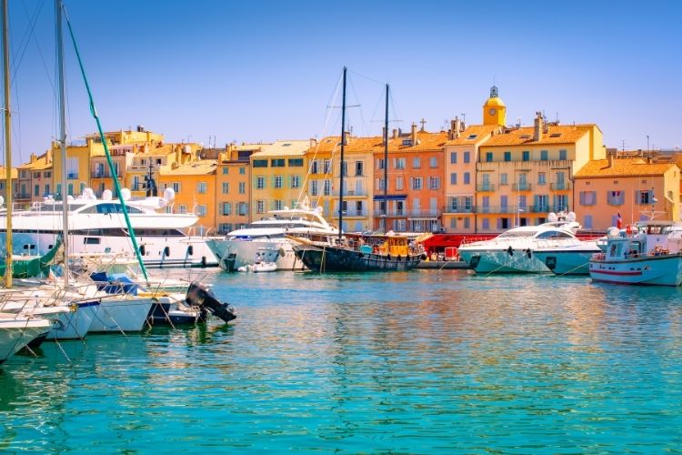 Boats at a dock in the sunshine. Taking your motorhome to Europe by Webbs.