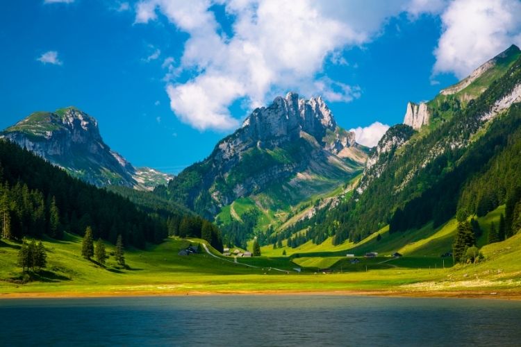 A lake with mountains in the background. Taking your motorhome to Europe by Webbs.