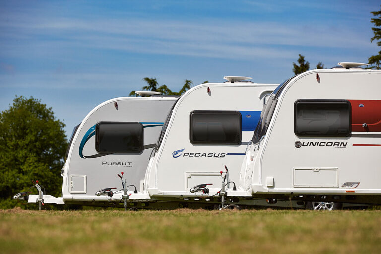 3 Bailey caravans parked in a field next to eachother. Bailey of Bristol Brand Showcase by Webbs.