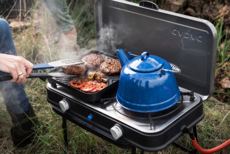 Cadac BBQ being used in an outdoor setting. Available to buy at Webbs Outdoors.